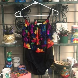 Flattering floral ruffles!  Black swimsuit. Sz 12